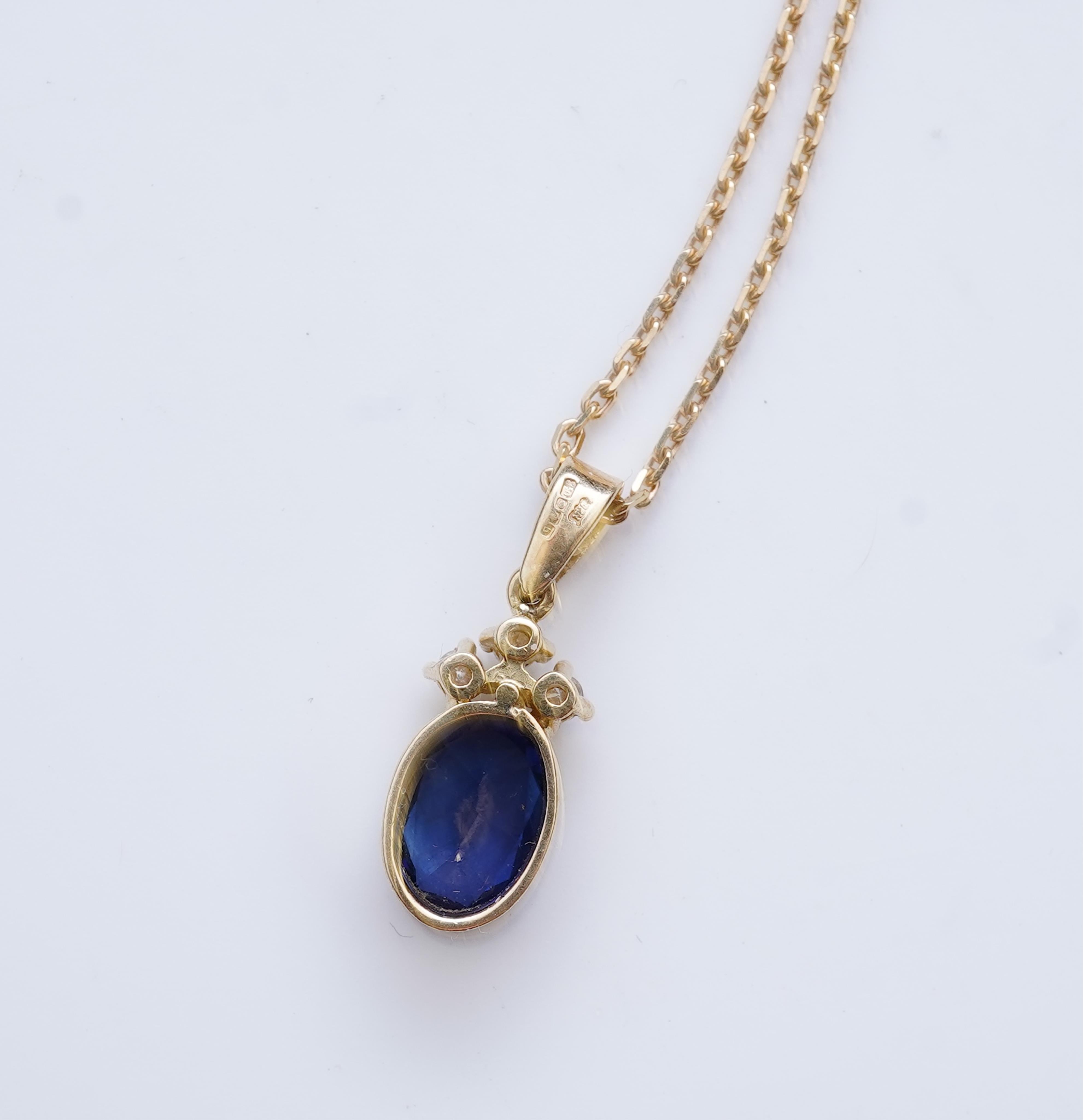 A sapphire and diamond pendant